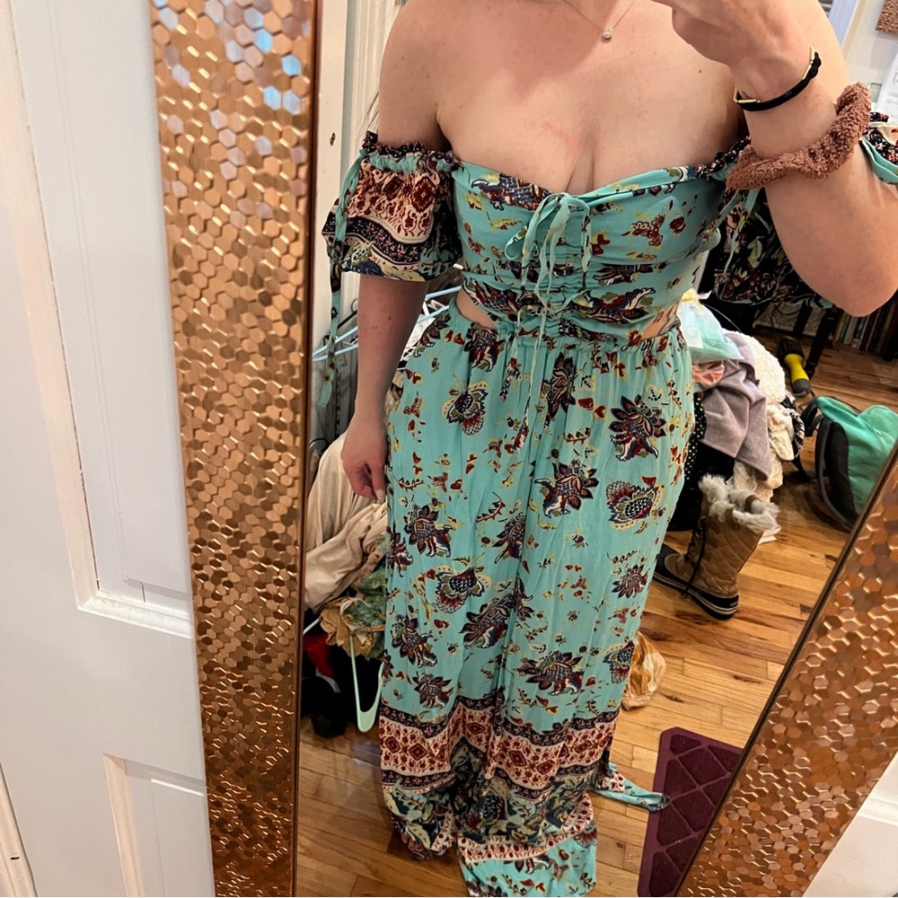 NWT Free People boho jumpsuit size small with side cutouts and off the shoulder